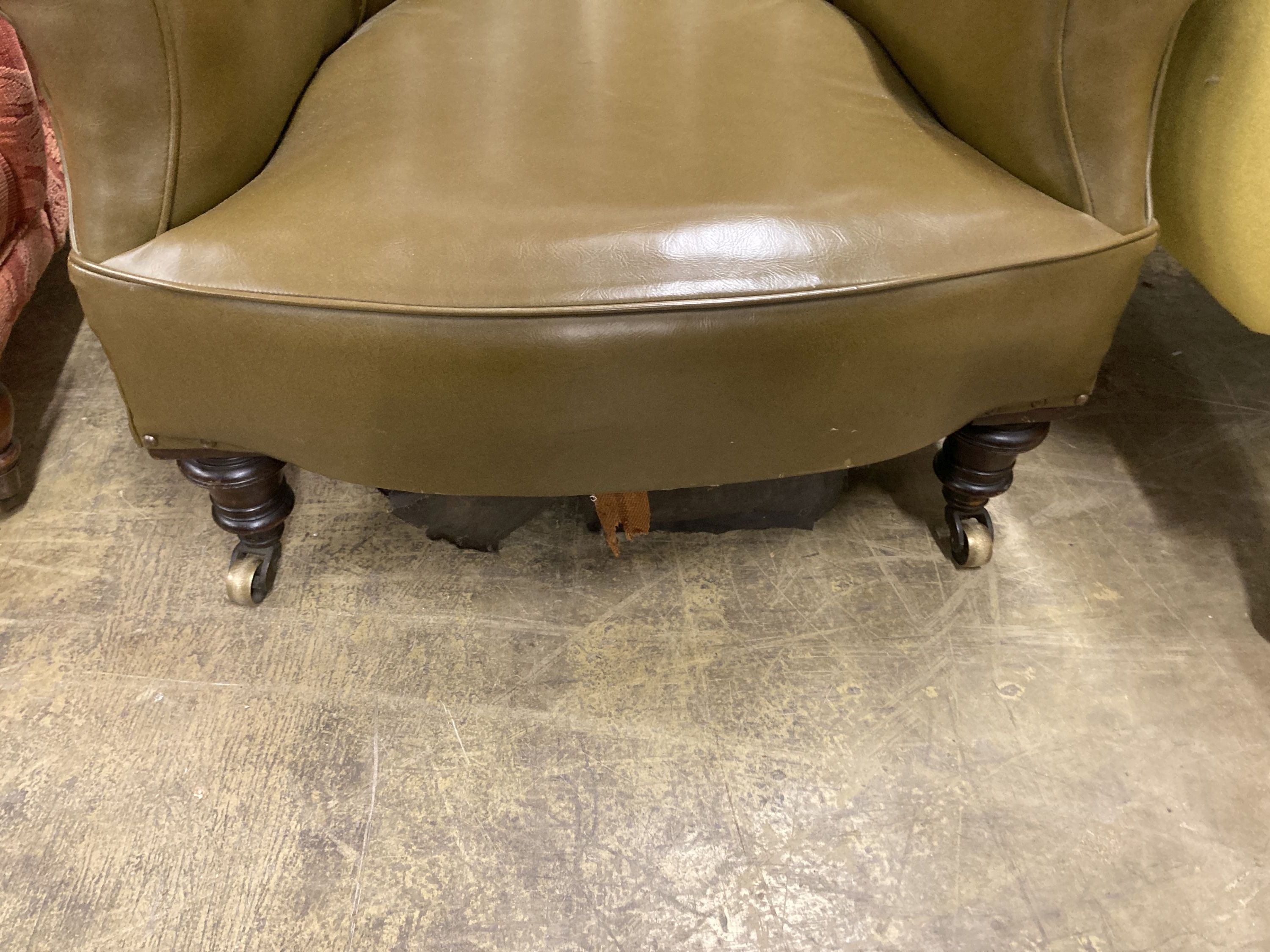 A Victorian library chair upholstered in olive green leather, width 80cm, depth 70cm, height 86cm